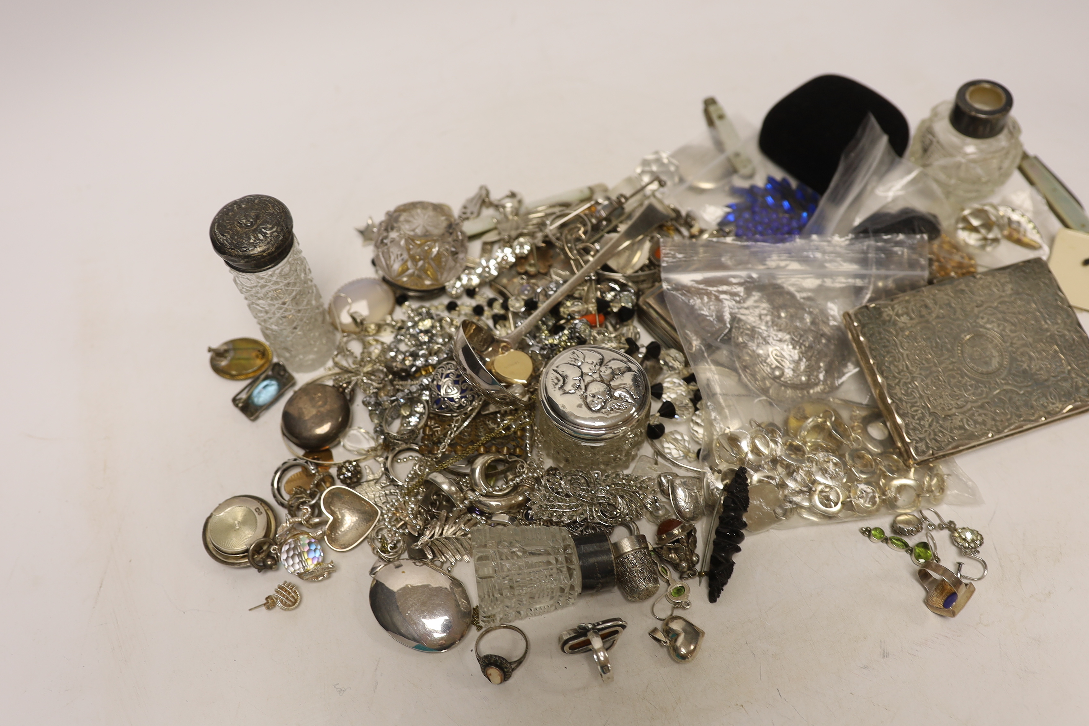 A group of assorted silver and jewellery, including a 19th century snuff box, sifter spoon and card case, a later toilet jar, scent bottle and sovereign case, necklaces, earrings and lockets including white metal and oth